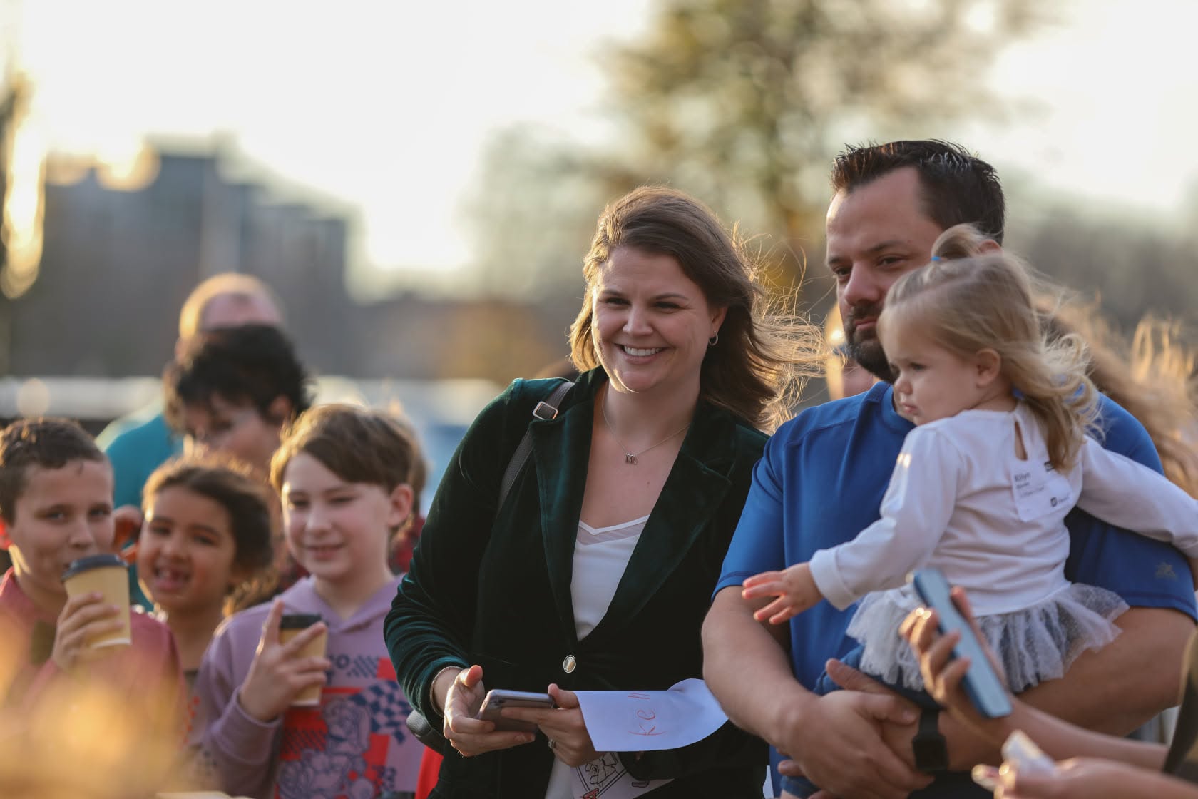 Family walking outdoors at Christmas event